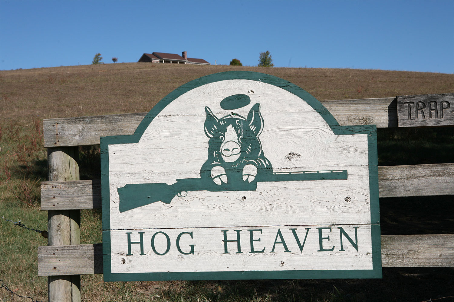 Hog Heaven Gun Club sign with the hog and shotgun logo