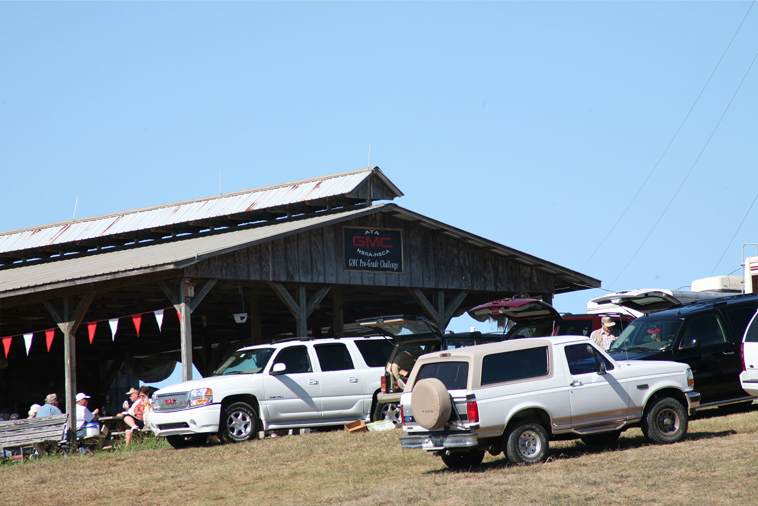 Covered pavilion with trucks parked out front