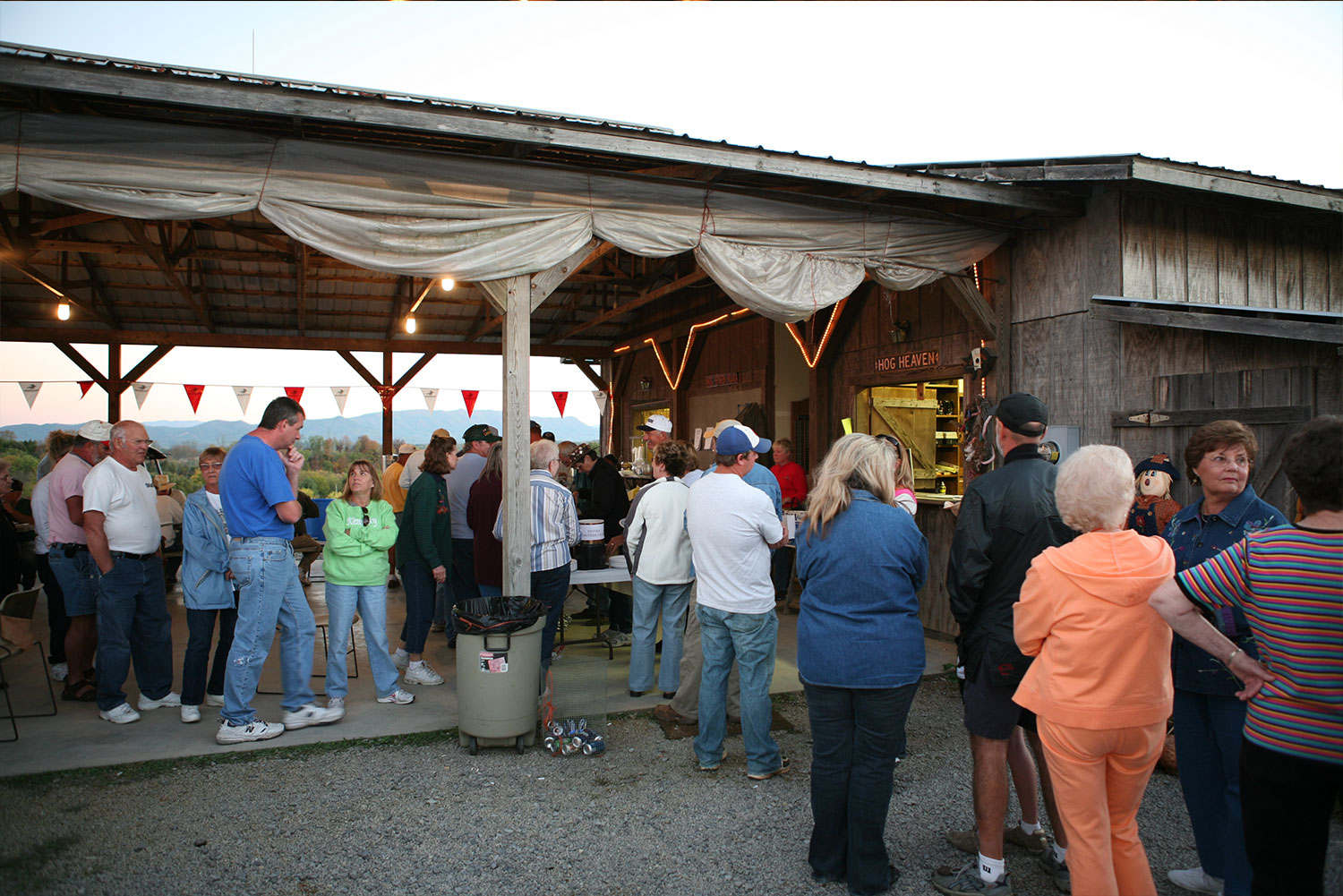 Crowd lining up for the potluck under the pavilion