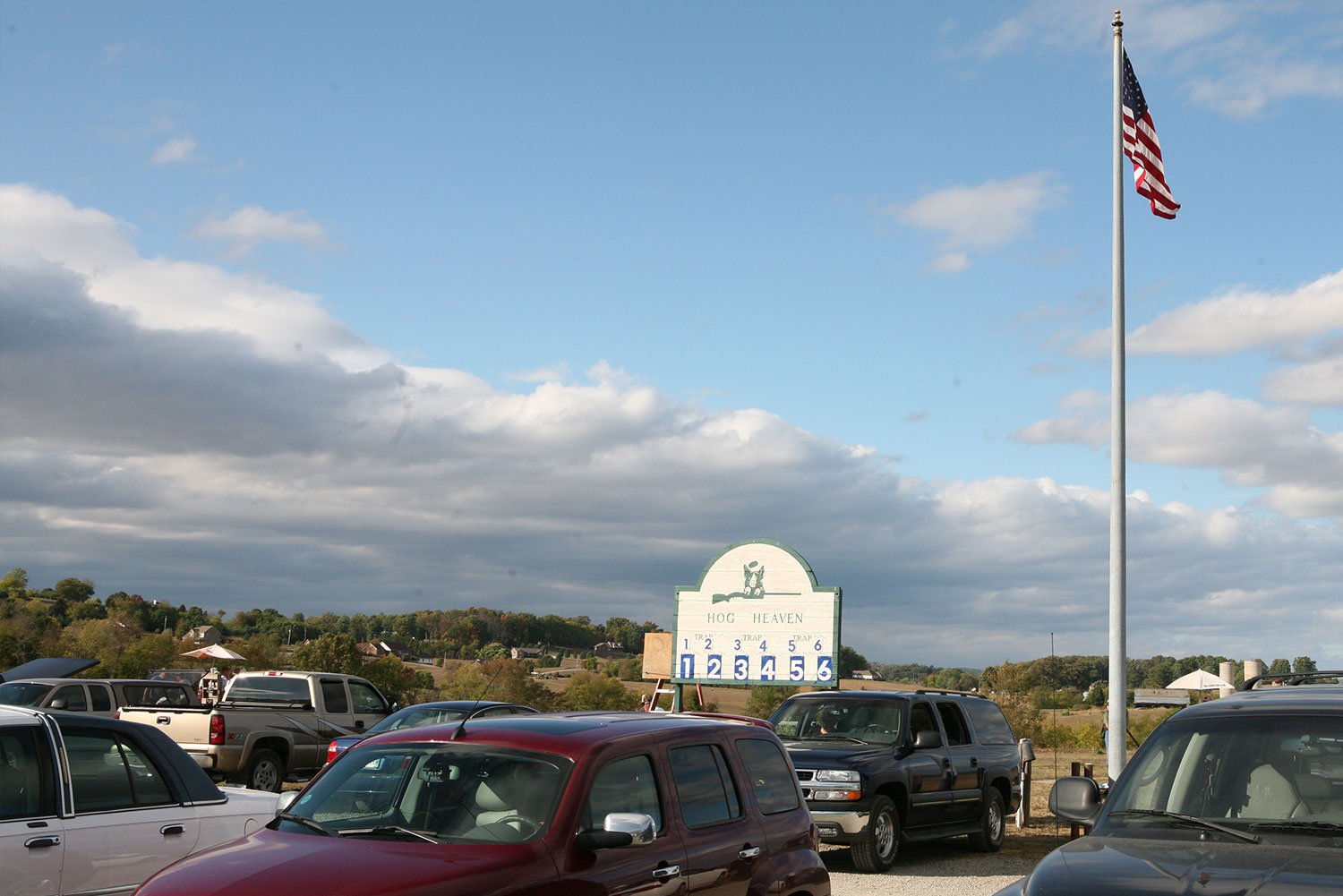 Hog Heaven scoreboard and American flag above the parking area
