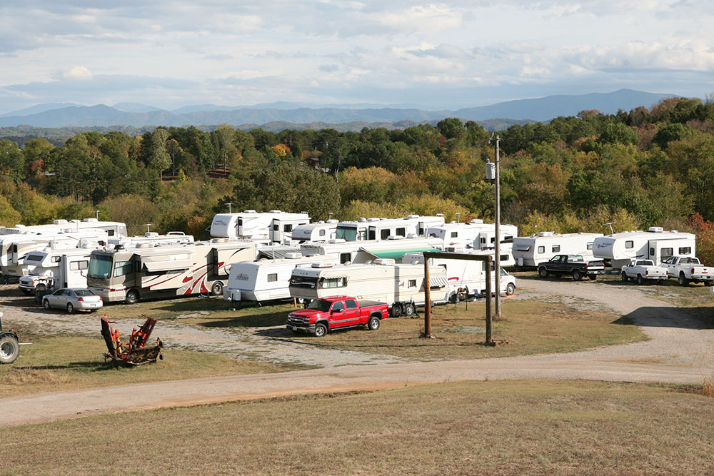 Rows of RVs camped at Hog Heaven with the Smoky Mountains behind